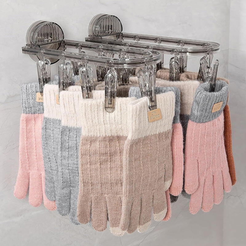 Suction cup folding clothes hanger with clip